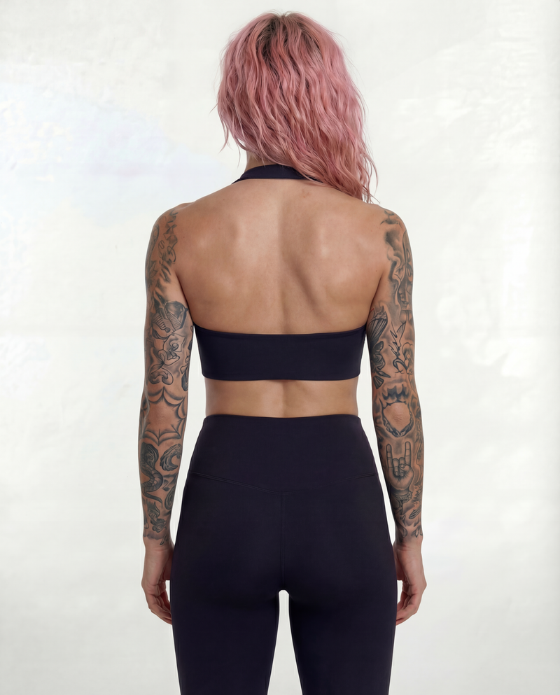 Full back view of the LOAR black Halo Flex Halter and seamless leggings, showcasing the open-back design and high-waisted fit. Premium alternative activewear.