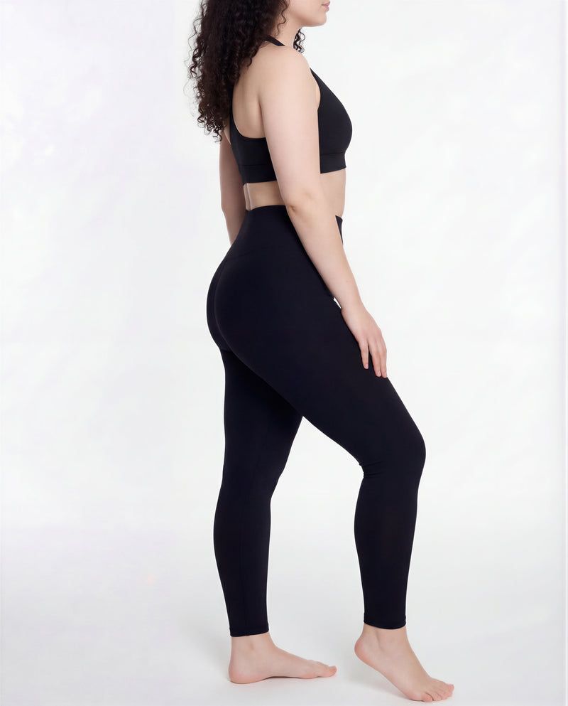 Back angle view of the LOAR black seamless leggings, highlighting the seamless sculpted fit. Premium alternative activewear.