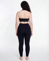Full back view of the LOAR black seamless leggings, highlighting the contoured fit. Premium alternative activewear.